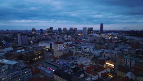 Aerial-drone-view-of-Old-City-and-Bratislava-Downtown-with-modern-business-buildings-in-evening