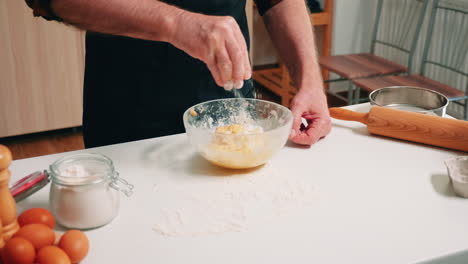 Adding-flour-on-dough