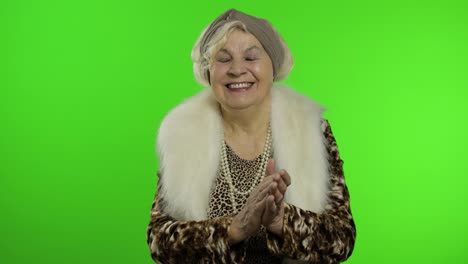 Elderly-stylish-grandmother.-Caucasian-woman-claps-her-hands.-Chroma-key