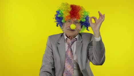 Senior-elderly-clown-businessman-entrepreneur-boss-in-wig-show-ok-sign