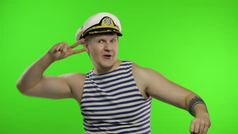 Young-sailor-man-dances-and-celebrates.-Seaman-guy-in-sailor's-vest.-Chroma-key