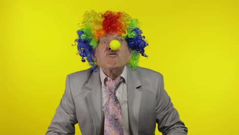 Senior-clown-businessman-entrepreneur-boss-making-silly-faces