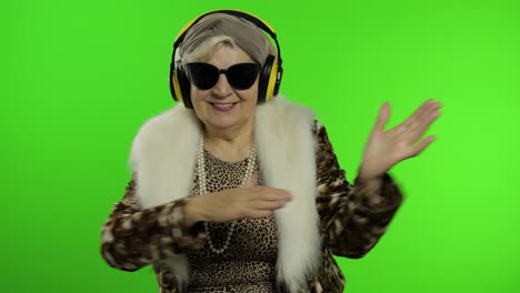 Elderly-grandmother.-Caucasian-woman.-Dance,-celebrate,-listen-music.-Chroma-key