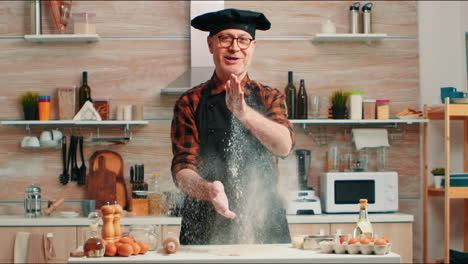Chef-clapping-hands-filled-with-flour