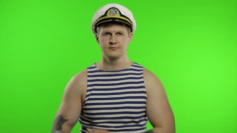 Young-sailor-man-arms-crossed,-looking-at-camera.-Seaman-guy-in-sailor's-vest