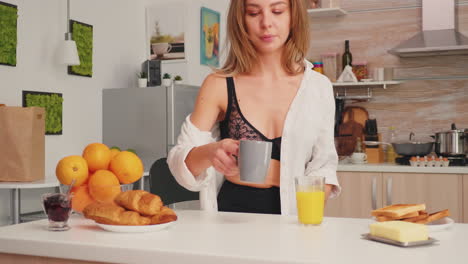 Seductive-woman-holding-cup-of-tea