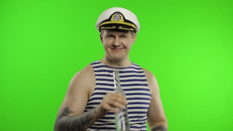 Sailor-man-walking,-drinks-vodka-from-bottle.-Seaman-guy-in-sailor's-vest.