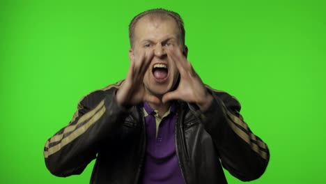 Expressive-rocker-man-screaming-and-shouting.-Studio-portrait-of-handsome-person-on-chroma-key