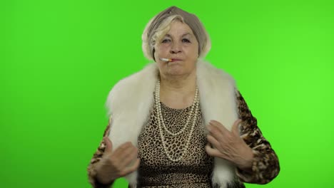 Elderly-stylish-grandmother.-Caucasian-woman-smoke-cigarette,-dance.-Chroma-key
