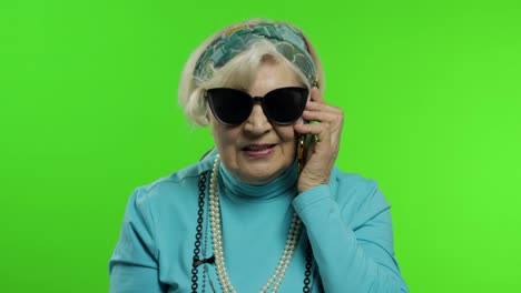 Elderly-stylish-caucasian-grandmother-woman-talking-on-mobile-phone.-Chroma-key