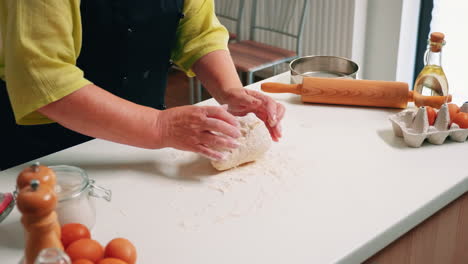 Old-woman-preparing-the-pastry-dough