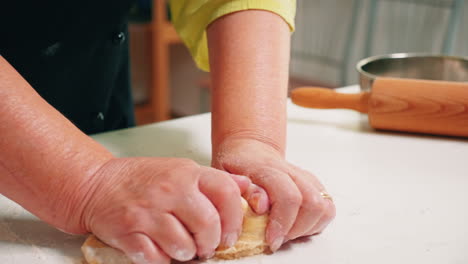 Close-up-of-grandmother-hands-kneading