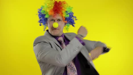 Clown-businessman-entrepreneur-in-wig-dancing,-celebrate,-making-silly-faces
