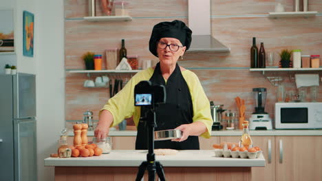 Elderly-woman-filming-cooking-vlog