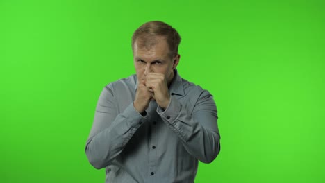 Funny-handsome-guy-trying-to-fight-at-camera,-boxing-with-expression.-Man-on-chroma-key-background