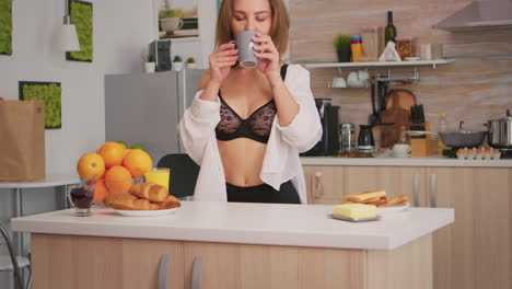 Woman-in-lingerie-drinking-coffee