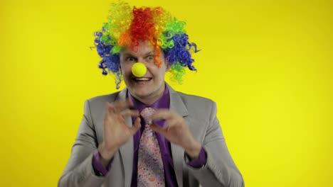 Clown-businessman-entrepreneur-boss-in-wig-shows-tricks-with-money-banknotes