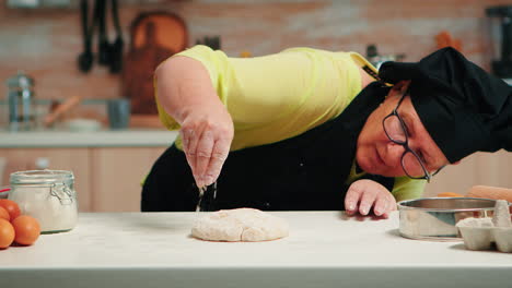 Woman-is-occupied-with-dough-preparation