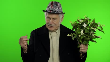 Elderly-caucasian-grandfather-man-with-bouquet-of-flowers-and-ring-goes-on-date