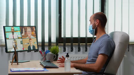 Man-having-video-call-with-remote-team