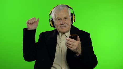 Elderly-caucasian-grandfather-man-dance,-celebrate,-listen-music.-Chroma-key