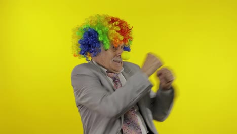 Elderly-clown-businessman-entrepreneur-dancing,-celebrate,-making-silly-faces