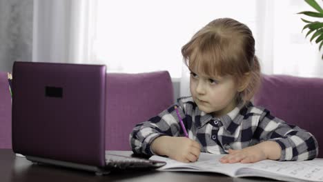 Girl-studying-online-homework-using-digital-laptop-computer.-Distance-education