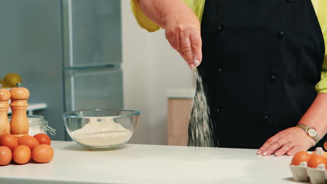 Close-up-of-spreading-flour