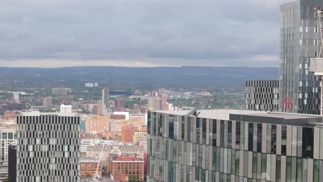 Close-up-aerial-view-Deansgate-square-Manchester-tall-contemporary-glass-skyscrapers-overlooking-downtown-city-landscape