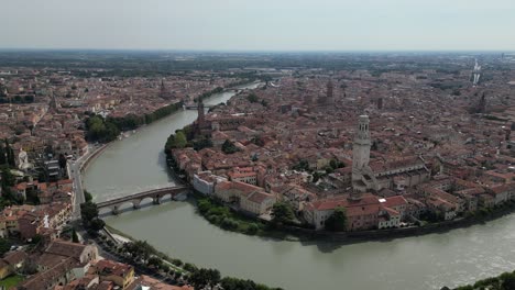 Aerial-shot-of-the-vintage-city-with-European-architecture-with-a-river-channel-flowing-through-the-city