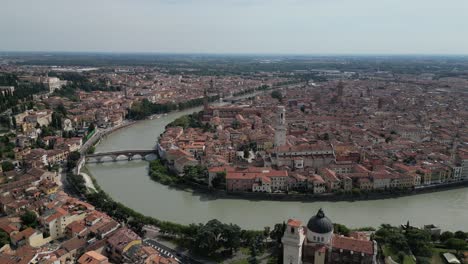 Aerial-shot-of-the-vintage-city-with-European-architecture-with-a-river-channel-flowing-through-the-city