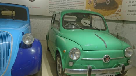 Fiat-500-Topolino-and-Fiat-600-vintage-classic-cars-on-display-at-Gedee-Museum,-Old-Fiat-Cars,-Coimbatore,-India