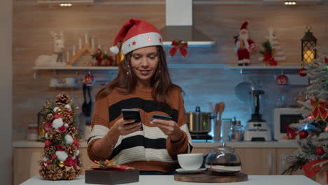 Festive-adult-using-smartphone-for-online-shopping