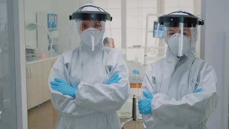 Professional-team-of-dentists-in-ppe-suits-standing