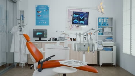Zoom-in-shoot-of-stomatology-orthodontist-office-room-with-tooth-xray-images-on-monitor
