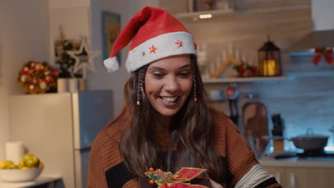 Cheerful-caucasian-woman-opening-presents-from-friends