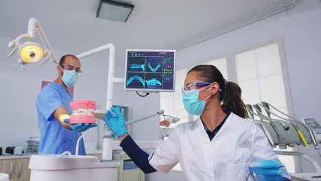 Patient-pov-of-dentist-teaching-correct-cleaning-of-teeth
