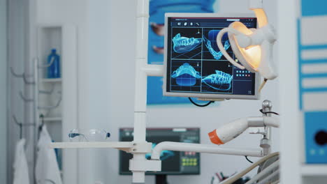 Close-up-of-medical-orthodontist-display-with-x-ray-images-on-it