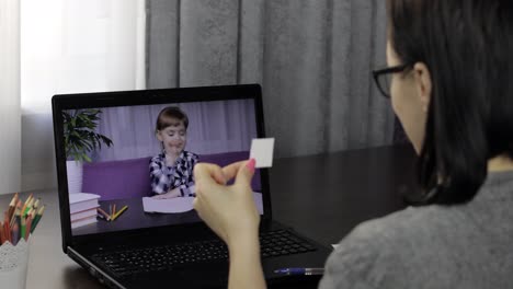 Teacher-making-video-call-on-laptop-with-pupil.-Distance-children-education