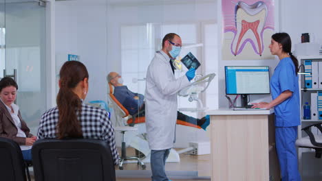Dentist-asking-nurse-for-dental-radiography