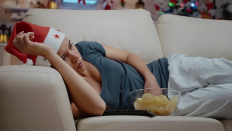 Close-up-of-woman-falling-asleep-while-watching-television