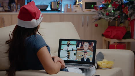 Woman-using-video-call-for-business-meeting-on-christmas-eve