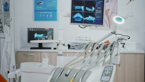 Closeup-revealing-shot-of-medical-orthodontic-display-with-teeth-xray-images-on-it