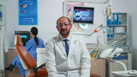 Man-stomatologist-speaking-on-video-camera