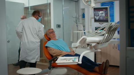Dentist-examining-teeth-with-medical-instruments
