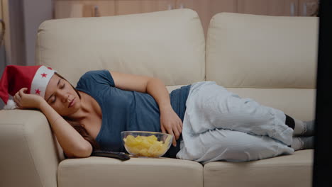 Close-up-of-woman-sleeping-on-couch-at-television