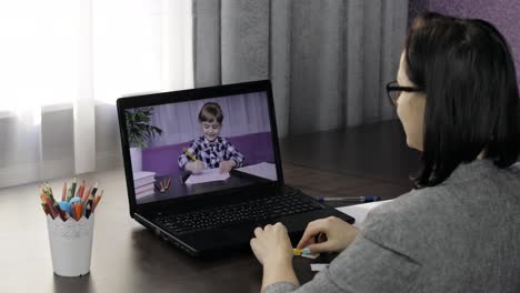 Woman-teacher-makes-video-call-on-laptop-with-children-pupil.-Distance-education