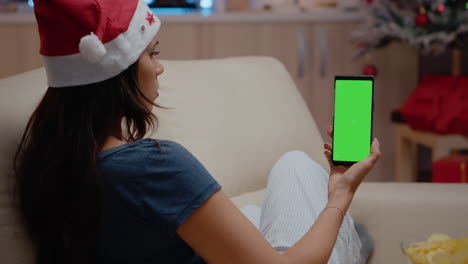 Woman-vertically-holding-smartphone-with-green-screen