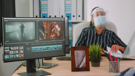 Videographers-with-protection-masks-working-at-video-project