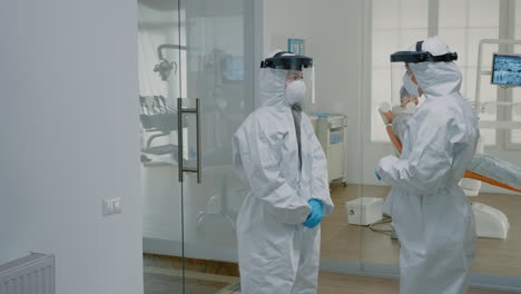 Stomatological-doctors-wearing-ppe-suits-at-dental-clinic